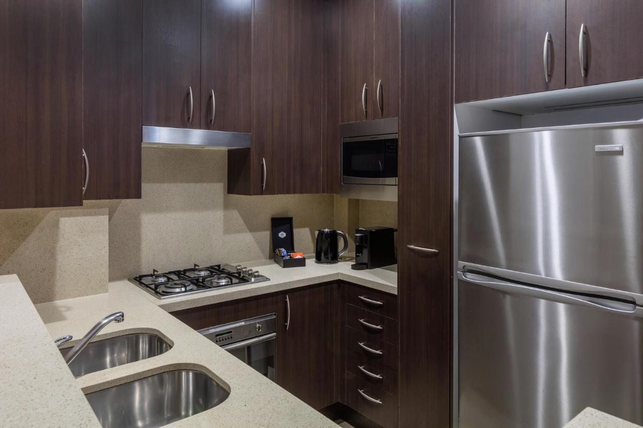 Meriton Suites Pitt Street, Sydney Exterior photo A typical kitchen in a serviced apartment